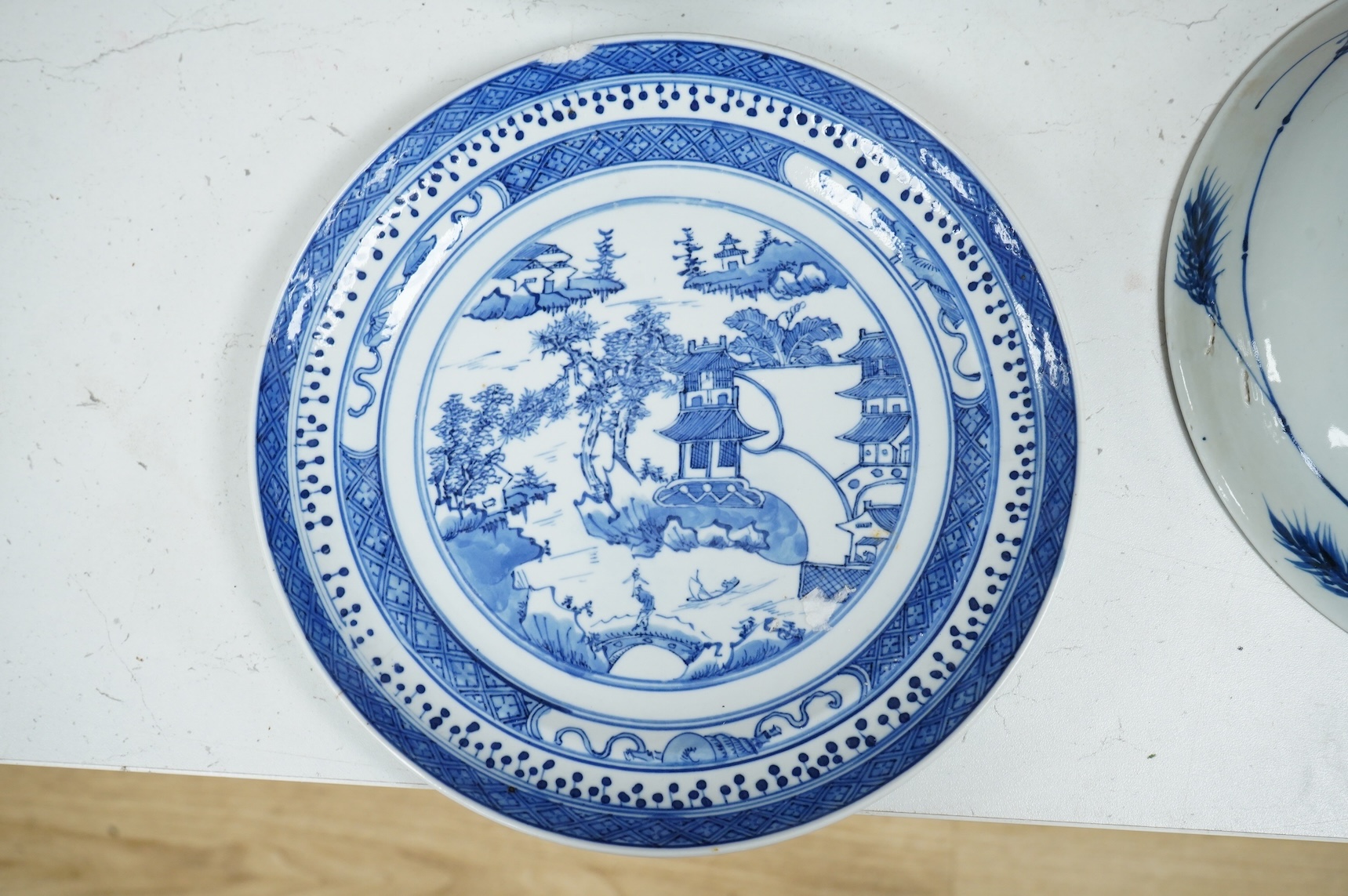 Three Chinese blue and white plates, largest 26cm